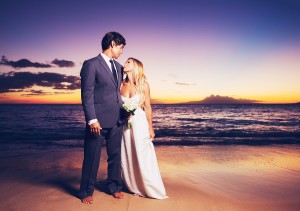 Beautiful Wedding Couple, Bride and Groom on the Beach at Sunset