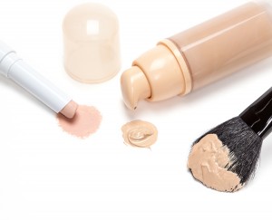 Concealer Pencil And Foundation With Makeup Brush