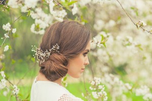 Beautiful Girl in spring garden. Girl with white flowers, spring