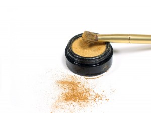 Gold eye shadow and brush