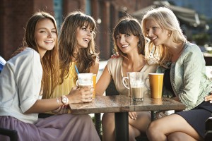 Group of young women drinking coffee