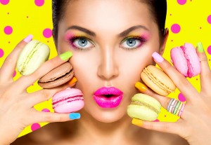 Beauty fashion model girl with colourful makeup and manicure tak