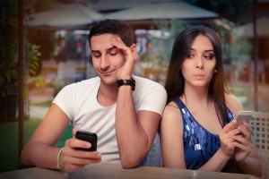 Young adult couple has privacy problems with modern technology