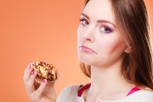 Unhappy Woman Holds Cake In Hand