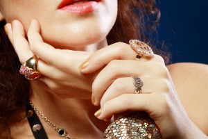 Woman with luxury jewelry hands close up