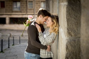 Candid Portrait Of Beautiful European Couple With Rose In Love K