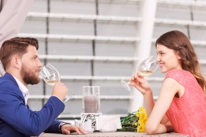 Nice couple drinking white wine in cafe