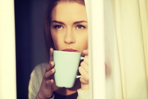 Beautiful caucasian woman drinking hot coffee or tea