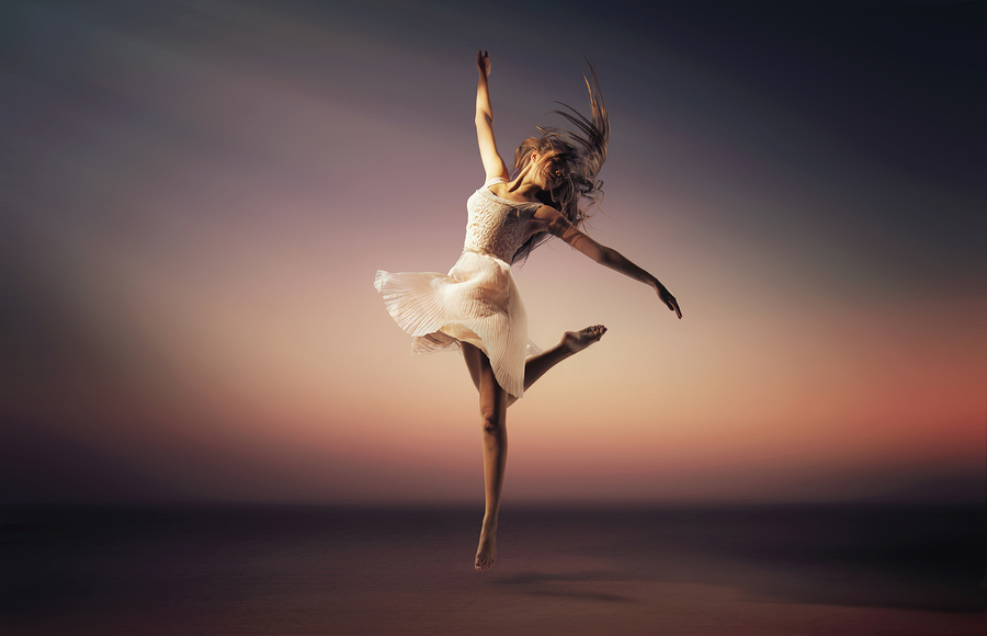 Fine art photo of a beautiful girl dancing