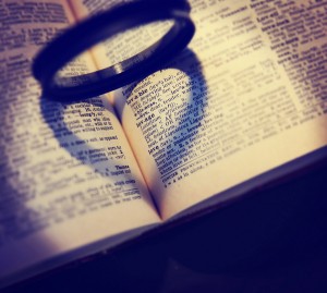 black filter ring casts a heart-shaped shadow in a dictionary bo