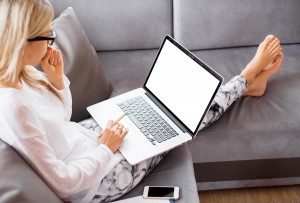 Busy woman working with computer at home