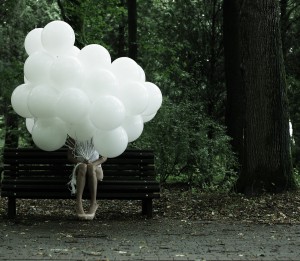 Sentimentality. Nostalgia. Lonely Woman With Air Balloons Sittin