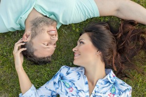 Cheerful young loving couple is relaxing in the nature