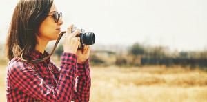 Tourist Woman Takes Photographs With Vintage Photo Camera