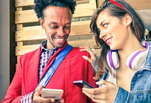 Multiracial Couple Flirting With Smartphone Numbers - Modern Con