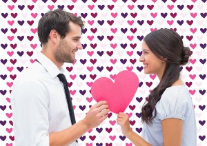 Pretty brunette giving boyfriend her heart against valentines da