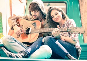 Romantic Couple Of Lovers Playing Guitar On Old Fashioned Mini C