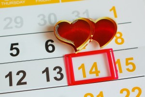 Date February 14 marked on the calendar. Two hearts the concept