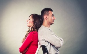 Young Couple After Quarrel Sitting Back To Back